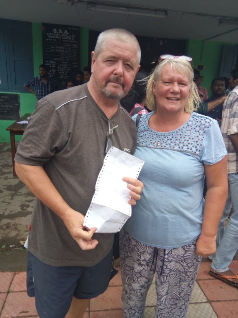 Other image for Couple help out India flood victims